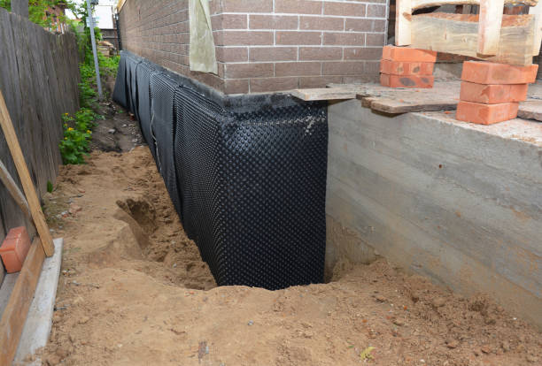 Happy homeowners after waterproofing job in Loudon